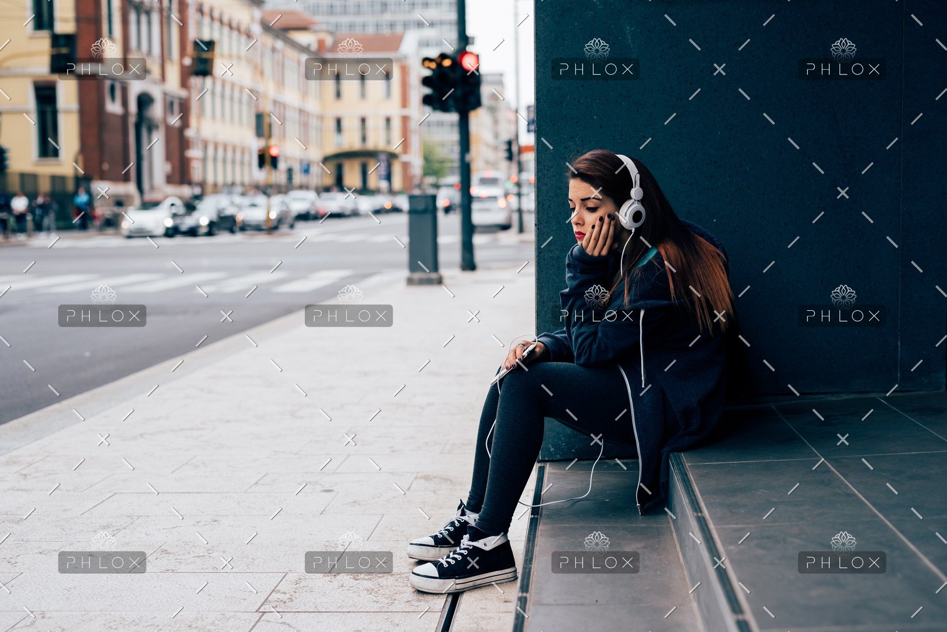 demo-attachment-19-young-woman-sitting-on-a-step-PE6MPZ9